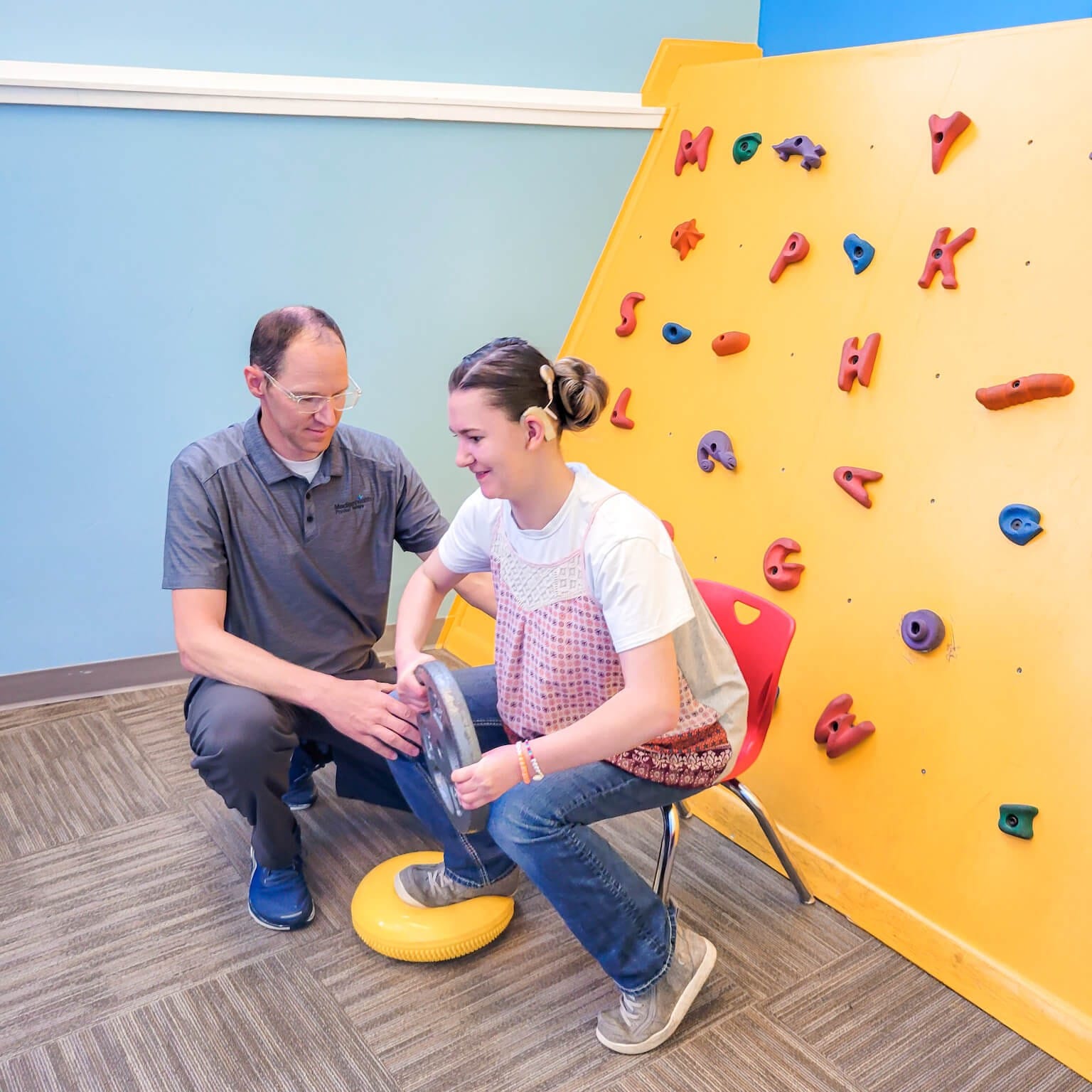 child working on movement and strength with physical therapist East Idaho