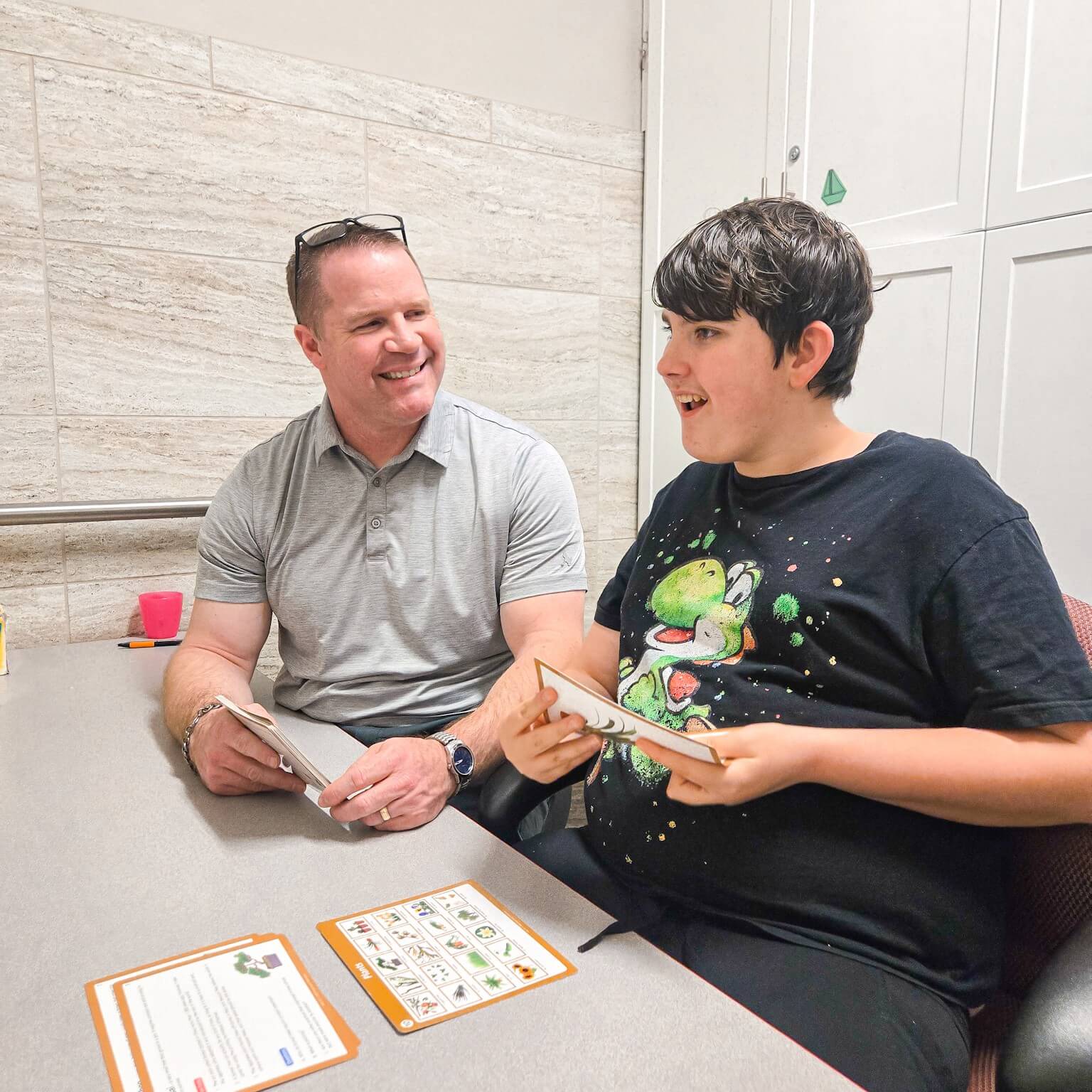 child practicing language skills with speech therapist during language delay therapy