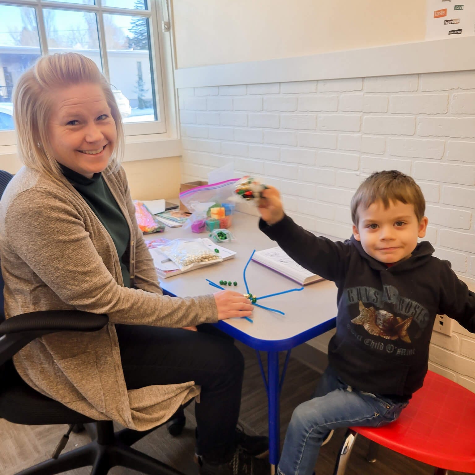 toddler practicing early communication skills with speech therapist